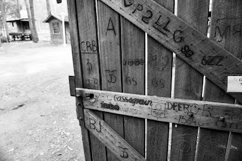 Gray Scale Photo of Brown Wooden Gate