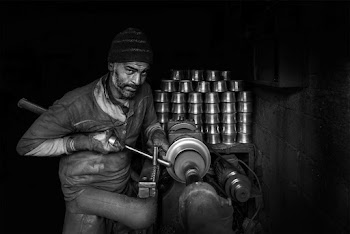 Gray-scale Photo of Man Making Cups