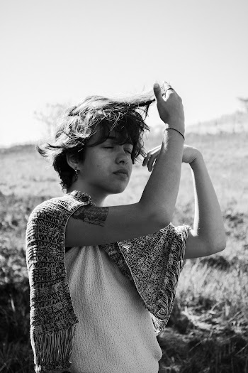 Gray-scale Photo of Woman Touching Her Hair with Her Eyes Closed