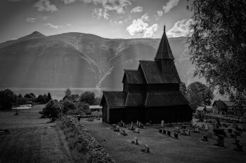 gray scale photo of wooden church