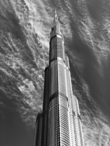 Gray scale photography of a concrete high-rise building