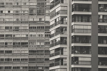 Gray-scale Photography of a Condominium Building