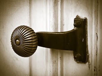 Gray Scale Photography of Doorknob