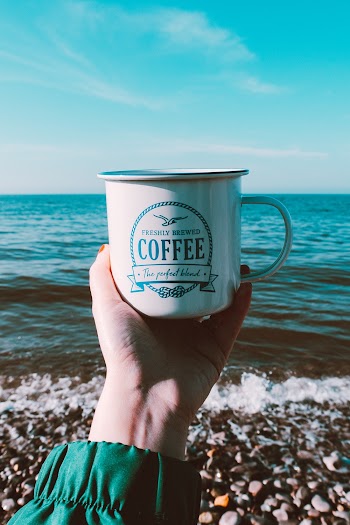 Gray Stainless Steel Coffee Cup at the Beach