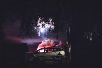 Gray Station Wagon Parked Beside the Tree during Nighttime