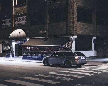 Gray Station Wagon Parked on Road at Night