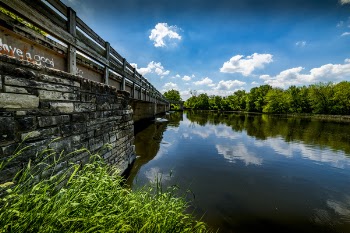 Gray Steel Bridge Near Body of Water