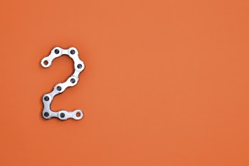 Gray Steel Chain on Orange Surface