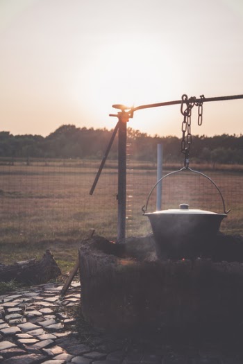 Gray Steel Cooking Pot Hanged by Brown Steel Chain