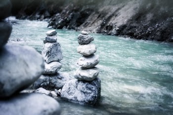 Gray Stock Pile Stone Near River in Gray Scale Photo