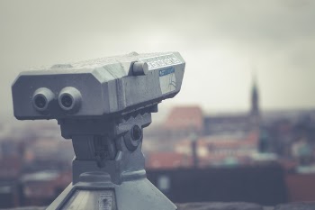 Gray Telescope Above Building