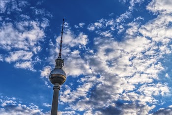 Gray Tower Under Blue and White Sky