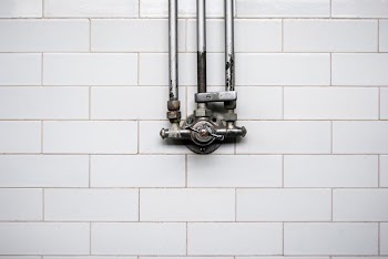 gray valve against white wall