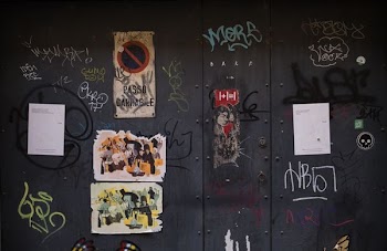 gray wall with graffiti
