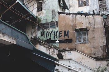 gray wall with Mayhem text