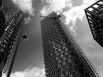 Grayscale and Worms Eye View of High-rise Buildings