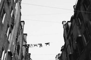 grayscale low angle photo of concrete buildings