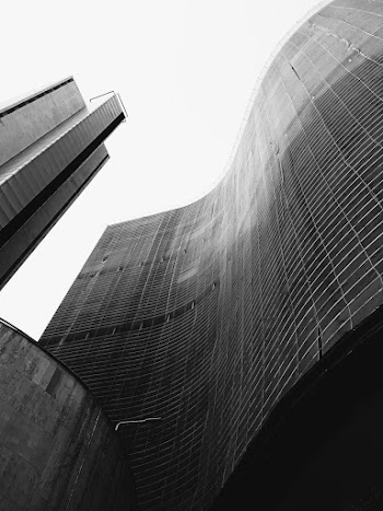 Grayscale Low Angle Photo Of High Rise Building
