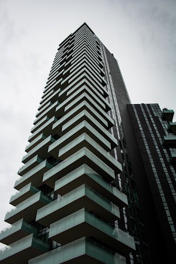 Grayscale Low Angle Photo of High Rise Building