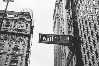 grayscale photo of 1-21 Wall street signage