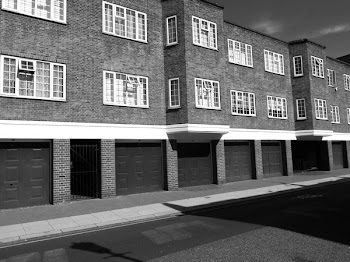 Grayscale Photo of 2-storey Building
