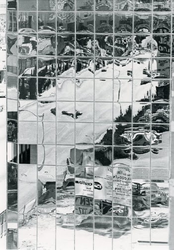 Grayscale Photo of a Glass Building · Free Stock Photo