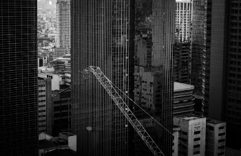 Grayscale Photo of a High Rise Building