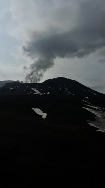 Grayscale Photo of a Smoking Volcano · Free Stock Photo