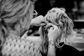 Grayscale Photo Of A Woman Fixing Another Woman's Hair