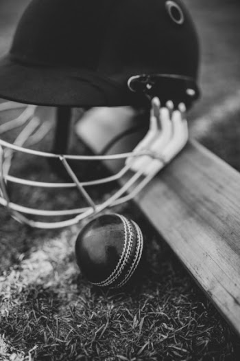 Grayscale Photo of Batting Helmet