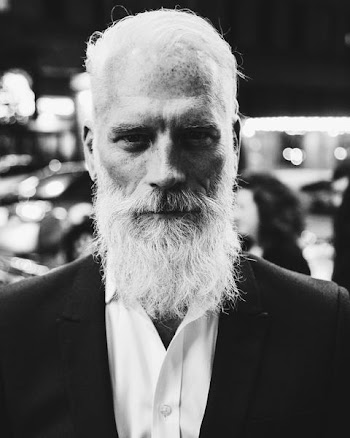 grayscale photo of bearded man