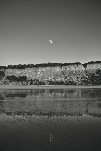Grayscale Photo of Body of Water Near Mountain · Free Stock Photo