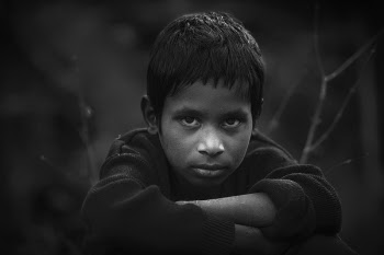 Grayscale Photo of Boy in Long-sleeved Shirt