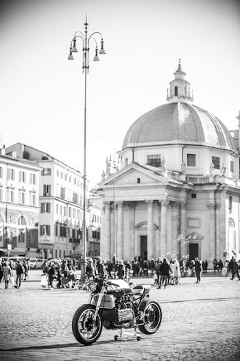 Grayscale Photo of Cafe Racer Near Dome Building