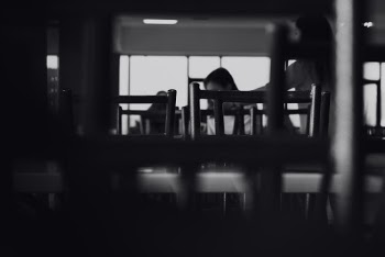 Grayscale Photo of Chairs Inside Restaurant