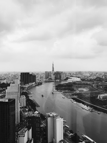Grayscale Photo of City Buildings