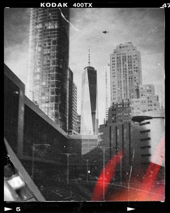 grayscale photo of city buildings