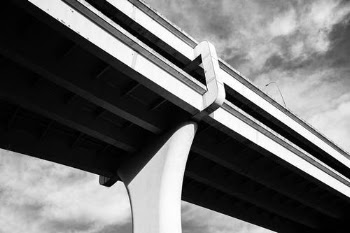 Grayscale Photo of Concrete Bridge · Free Stock Photo
