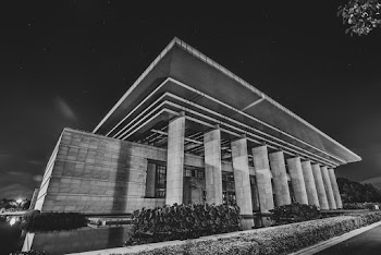 Grayscale Photo of Concrete Building