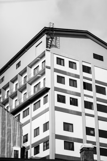 Grayscale Photo of Concrete Building