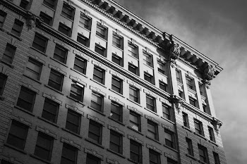grayscale photo of concrete building