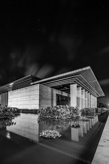 Grayscale Photo of Concrete Building
