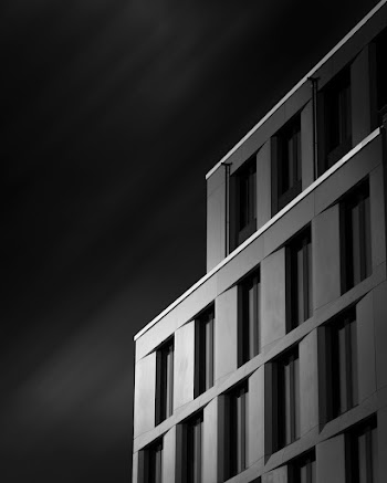 Grayscale Photo of Concrete Building