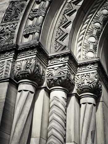 Grayscale Photo of Concrete Building With Pillars