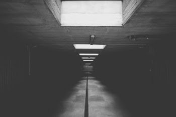 Grayscale Photo of Concrete Room