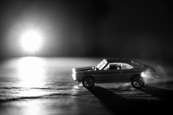 Grayscale Photo of Coupe Diecast
