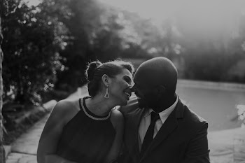 Grayscale Photo of Couple at Garden Near Pool