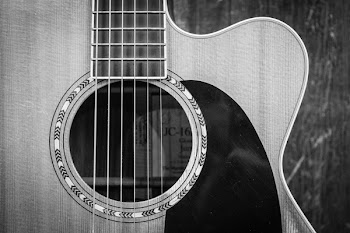 Grayscale Photo of Cutaway Acoustic Guitar