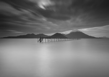 Grayscale Photo Of Dock During Cloudy Day