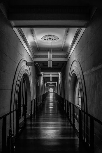 Grayscale Photo of Empty Hallway